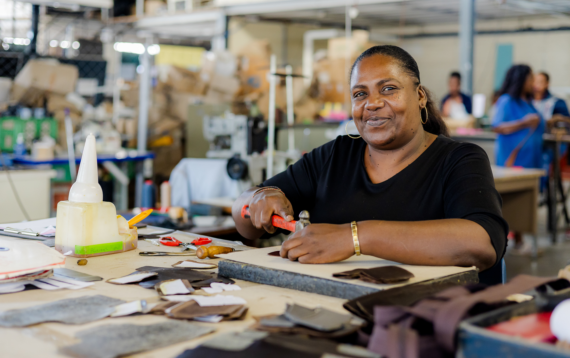 Precious Khulu, Vermont leather artisan, Leathercrafting and Sampling division in the Johannesburg factory